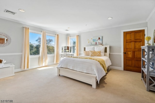 carpeted bedroom featuring crown molding