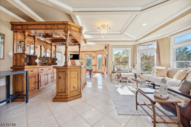 tiled living room with ornamental molding and a healthy amount of sunlight