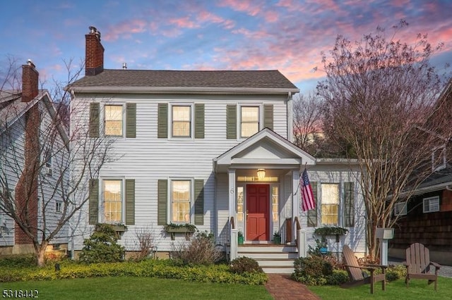 view of front of house featuring a chimney