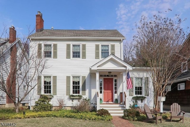 view of front of property with a chimney