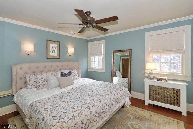 bedroom featuring radiator, wood finished floors, and ornamental molding