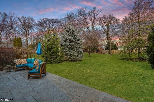 view of yard with outdoor lounge area, a patio, and fence