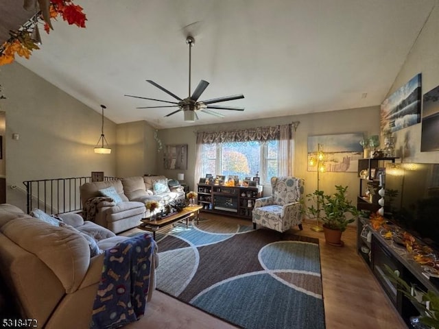 living room with lofted ceiling, a ceiling fan, and wood finished floors