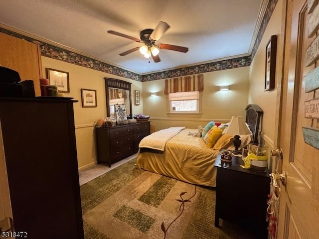 bedroom with ceiling fan, ornamental molding, and baseboards