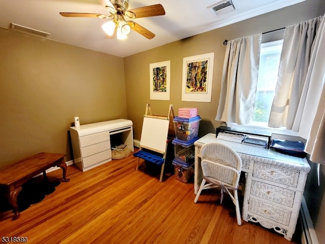 office area featuring ceiling fan and light hardwood / wood-style floors