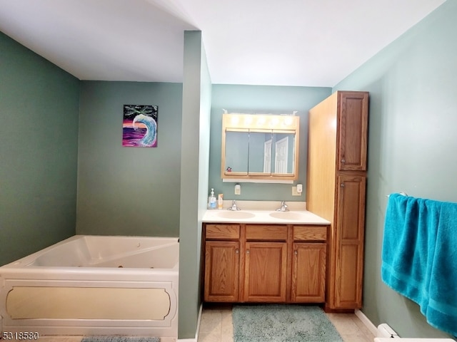 bathroom with vanity, tile patterned floors, and a tub