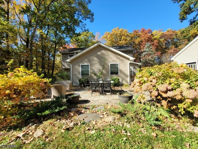 rear view of house featuring a patio area