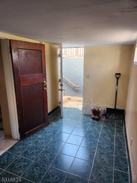 interior space featuring dark tile patterned floors