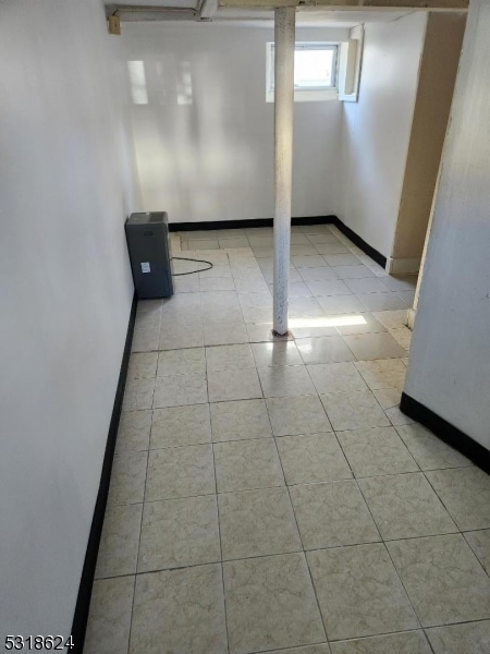 basement with light tile patterned floors