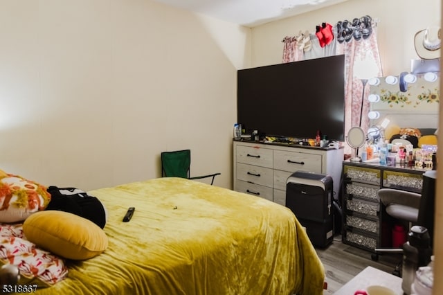 bedroom with light hardwood / wood-style flooring