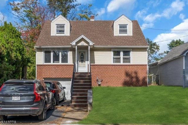 cape cod house with a front yard and a garage