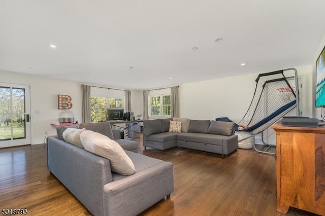 living area with recessed lighting and wood finished floors