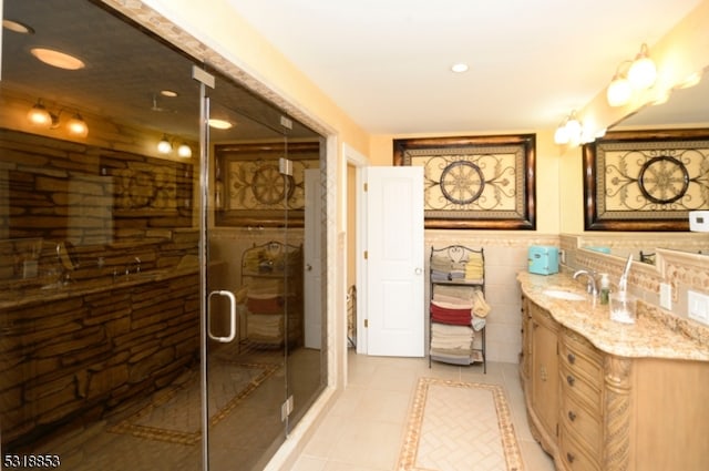 bathroom with vanity, tile patterned flooring, and a shower with door