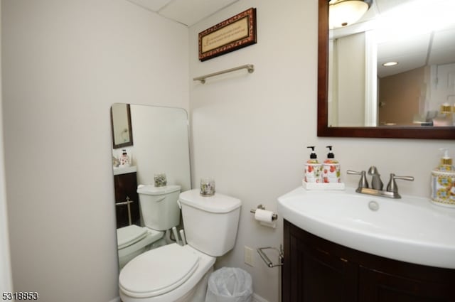 bathroom featuring toilet and vanity