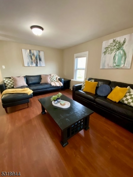 living room featuring radiator and wood-type flooring