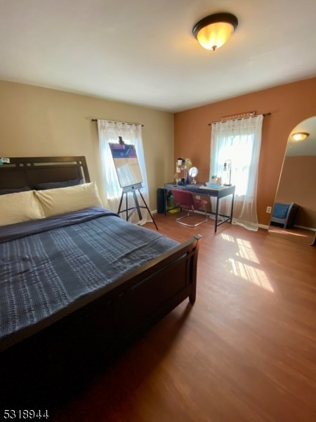 bedroom with wood-type flooring