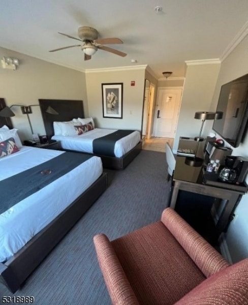 bedroom with crown molding and ceiling fan