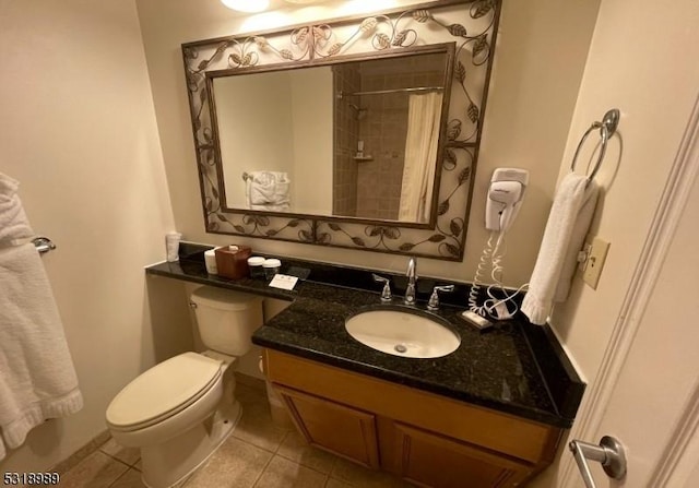full bathroom with toilet, tile patterned floors, curtained shower, and vanity