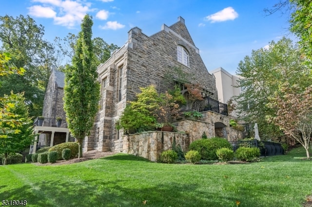 view of home's exterior featuring a yard