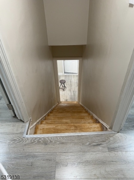 stairs with wood-type flooring