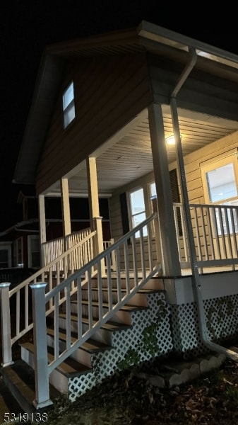 view of side of home featuring a porch