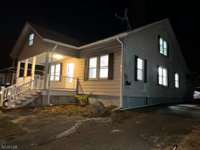 view of property exterior at night