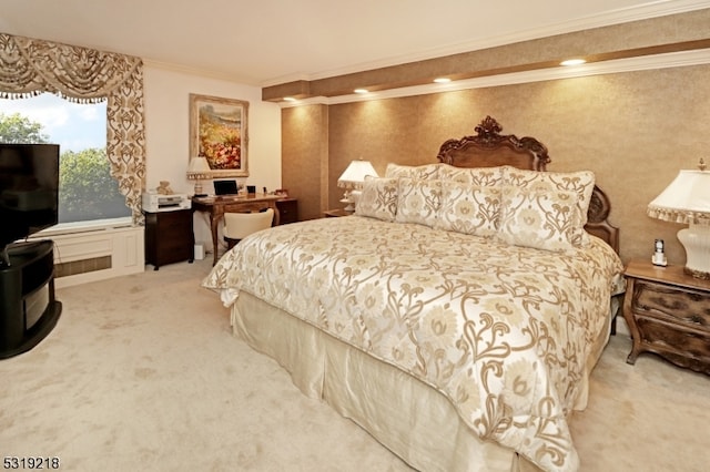 bedroom featuring crown molding and carpet