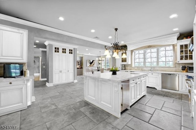 3 Winston Farm Ln, Mendham Twp, NJ 07931 - kitchen with stainless steel dishwasher, ornamental molding, a kitchen island, backsplash, and white cabinets