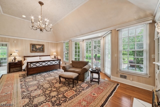 bedroom featuring access to outside, vaulted ceiling, hardwood / wood-style flooring, ornamental molding, and an inviting chandelier