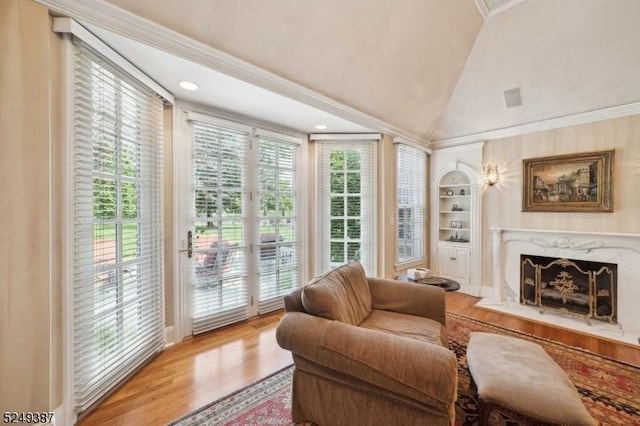 3 Winston Farm Ln, Mendham Twp, NJ 07931 - living area with wood finished floors, high vaulted ceiling, a high end fireplace, crown molding, and built in shelves
