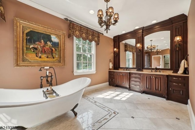 3 Winston Farm Ln, Mendham Twp, NJ 07931 - bathroom with a chandelier, a soaking tub, baseboards, double vanity, and ornamental molding