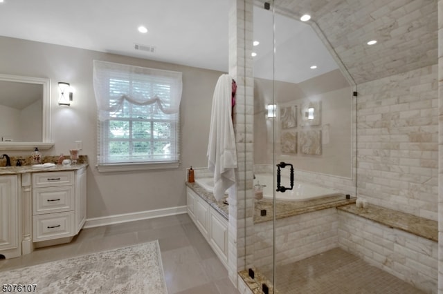 bathroom with vanity, tile patterned floors, and independent shower and bath