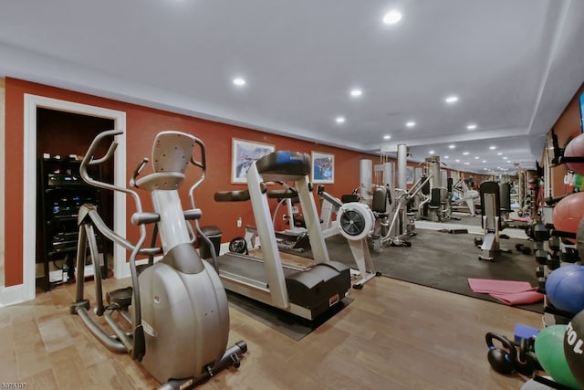 workout area with light wood-type flooring