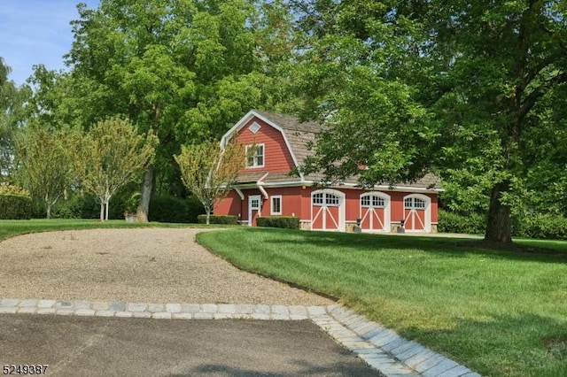 3 Winston Farm Ln, Mendham Twp, NJ 07931 - view of front facade featuring a gambrel roof, a barn, a front lawn, an outdoor structure, and driveway