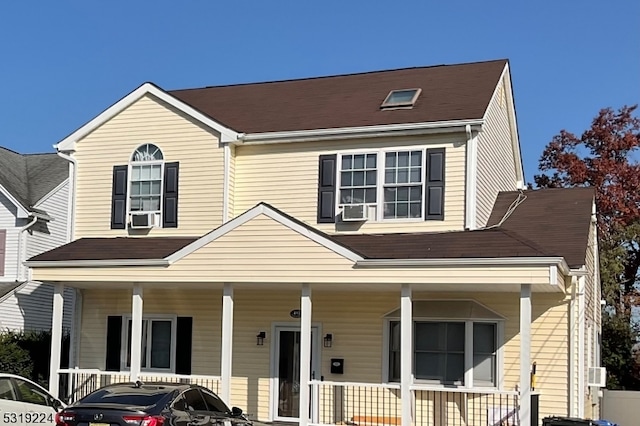 view of front of house featuring a porch and cooling unit