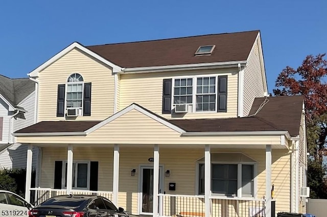 view of front of property with covered porch and cooling unit