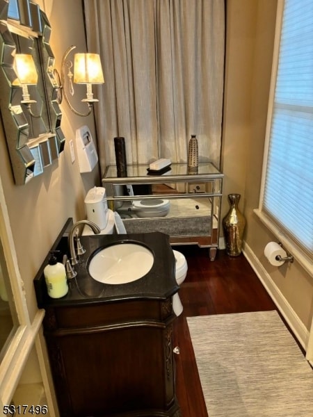 bathroom featuring vanity and hardwood / wood-style flooring