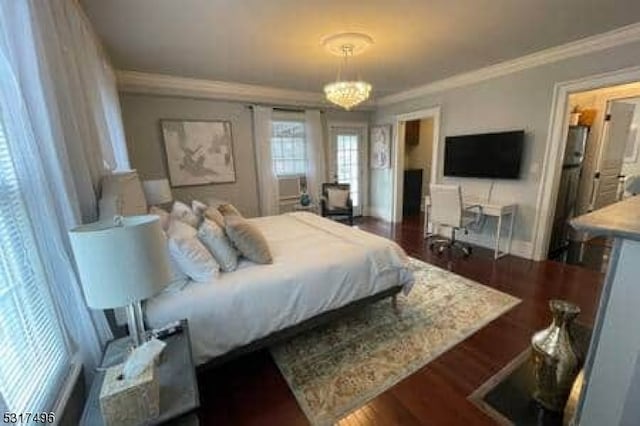 bedroom featuring a notable chandelier, ornamental molding, and dark wood-type flooring