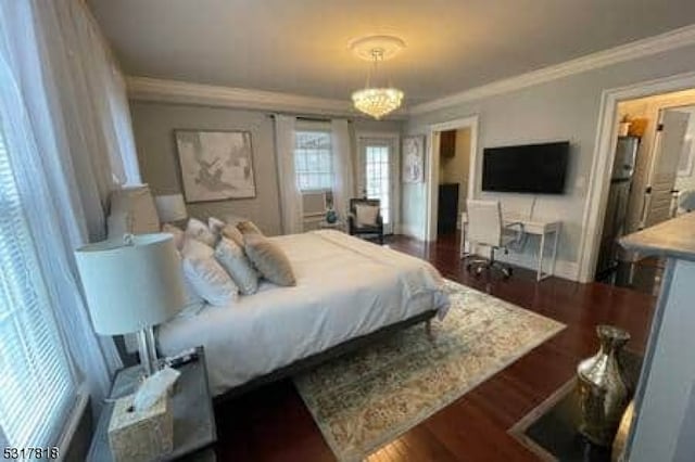 bedroom featuring crown molding, a notable chandelier, and dark hardwood / wood-style floors