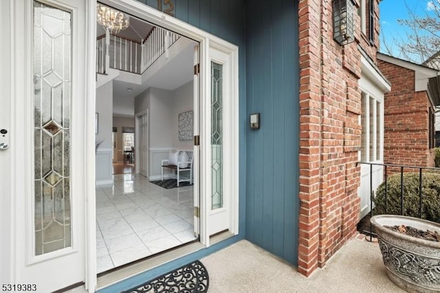 entrance to property with brick siding