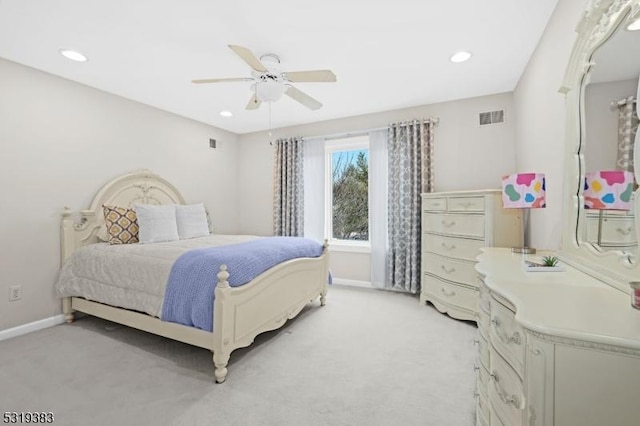 bedroom featuring light colored carpet, visible vents, ceiling fan, and baseboards