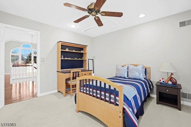 bedroom with a ceiling fan, recessed lighting, visible vents, and attic access