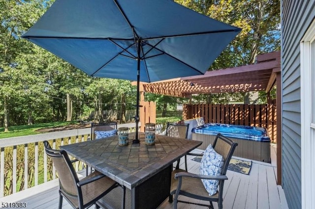 wooden terrace with outdoor dining space, a hot tub, and a pergola