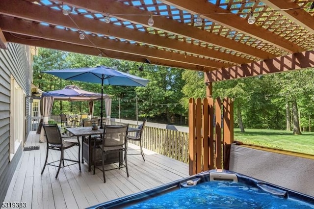 wooden terrace featuring outdoor dining space, an outdoor hot tub, and a pergola