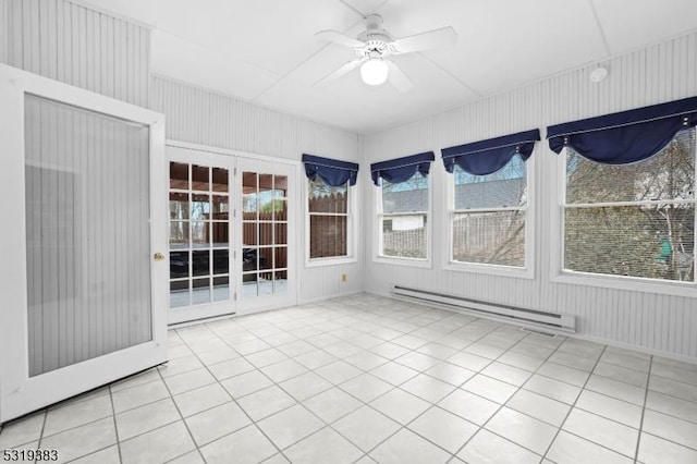 unfurnished sunroom featuring a ceiling fan and a baseboard radiator