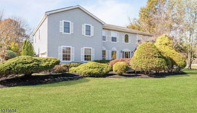 view of front of home with a front yard