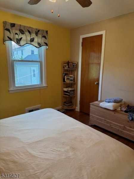 bedroom featuring ceiling fan and wood-type flooring