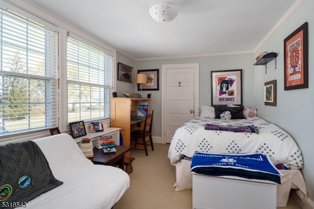 bedroom featuring crown molding and light colored carpet