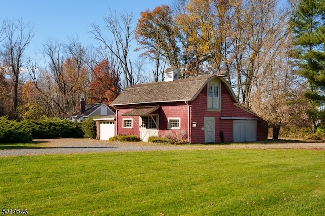 exterior space with a front lawn and a garage