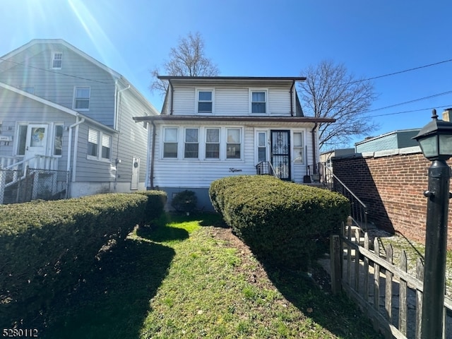 view of property featuring a front yard